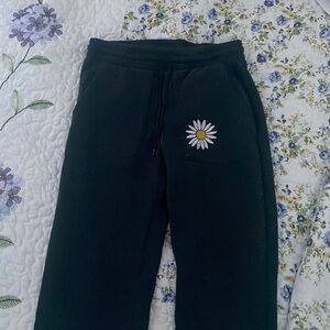Flower stitched on sweats
